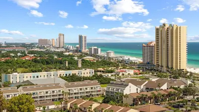 an aerial view of a city with buildings and the ocean at West End Coastal Escape Renovated 1BR Condo w Pool Beach Access 72 in Panama City Beach