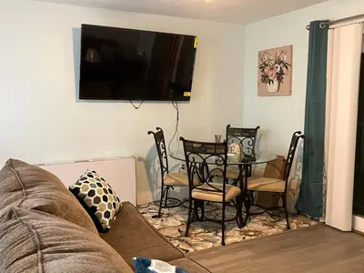 a living room with a couch and a table at Make Your Getaway in Panama City Beach