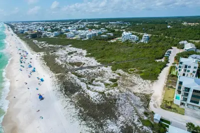 an aerial view of a beach with people and buildings at 30A Hideaway l Ocean Views l Across street from beach l Rosemary Beach in Inlet Beach