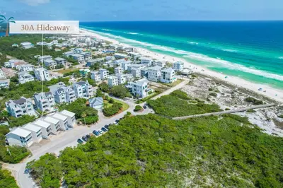 an aerial view of a beach with condos at 30A Hideaway l Ocean Views l Across street from beach l Rosemary Beach in Inlet Beach