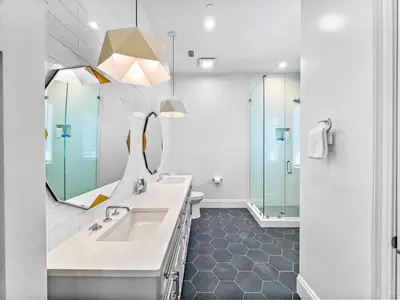 a bathroom with a sink and a mirror at Summer Wind l Ocean Views, Steps to Beach, Private Pool and Jacuzzi, Golf Cart, Bikes, Ample Parking in Seagrove Beach
