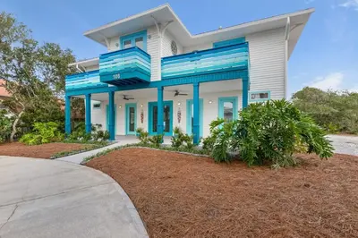 a house with blue trim and a driveway at Aqua! Under The Sea! - Beach Access! - Pool! in Seacrest