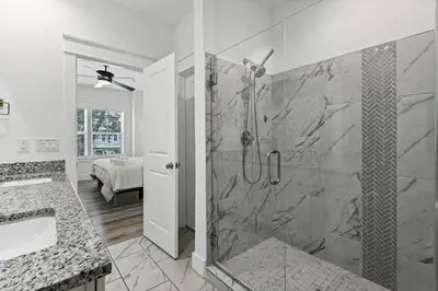 a bathroom with a shower and a sink at Blue Lagoon (3/2.5) in Panama City Beach