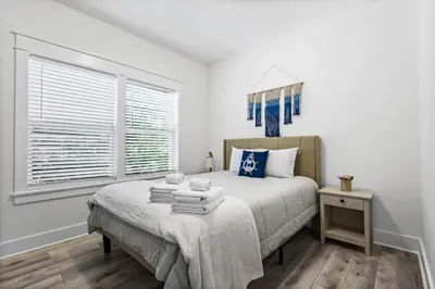 a bedroom with a bed and a window at Blue Lagoon (3/2.5) in Panama City Beach
