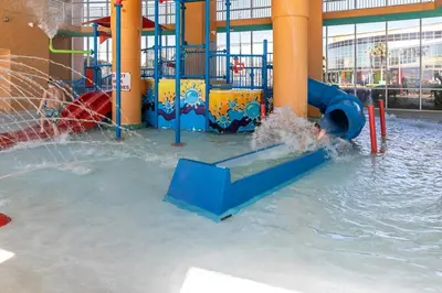 a water park with a water slide in the water at Beachfront Condo in Panama City Beach! in Panama City Beach