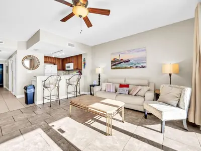 a living room with a couch and a table at Seychelles 2107 - The Osprey at Seychelles Resort in Panama City Beach