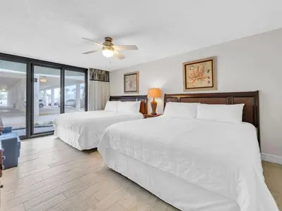 a bedroom with two beds and a ceiling fan at Watercrest 110 in Panama City Beach