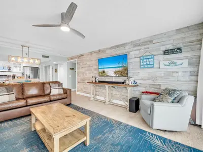 a living room with a couch and a table at Watercrest 110 in Panama City Beach