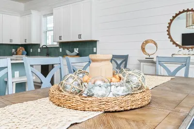 a basket of glass items on a table in a kitchen at Luxe 8BR with Pool, Golf Cart - 2 Min to Beach in Santa Rosa Beach