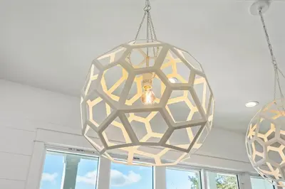 a chandelier hanging from a ceiling in a room at Ovation- Pool, Beach, Sleeps 21! in Santa Rosa Beach