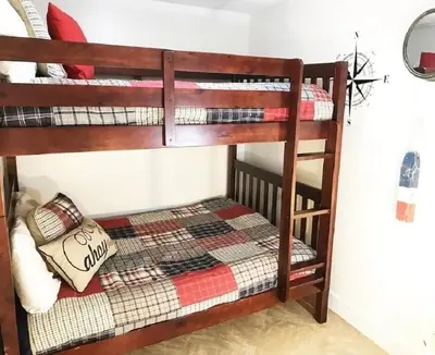 a couple of bunk beds in a room at Peaks and Tide - Majestic Beach Resort in Panama City Beach