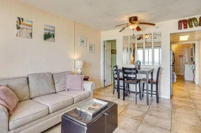 a living room with a couch and a table at Prime Beach Access and Gulf-View Balcony! PBC Condo in Panama City Beach
