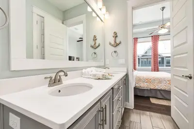 a bathroom with a sink and a mirror at Golf Cart Included - Beach - Pool - Pet Friendly in Santa Rosa Beach