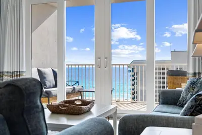 a living room with a view of the ocean at Spacious 3BD 2BA Beach Retreat! 5 Pool Resort! by Dolce Vita Getaways PCB in Panama City Beach
