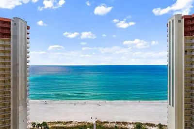 a view of the beach from a hotel window at Shores of Panama Modern 2BR 2BA! Gulf View Resort! by Dolce Vita Getaways PCB in Panama City Beach