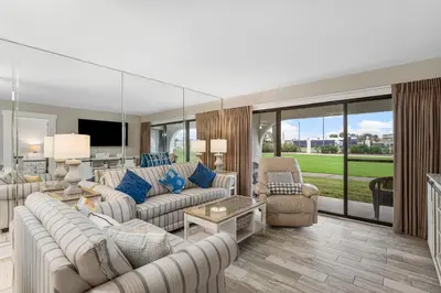 a large living room with couches and chairs at Mermaid's Den in Panama City Beach