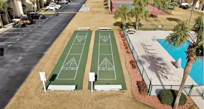 an overhead view of a tennis court next to a street at Coastal Getaway! Walk to Beach! Pools & Tennis! Pet Friendly! by Dolce Vita Getaways PCB in Panama City Beach