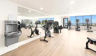 a gym with a bunch of treadmills and exercise bikes at One Seagrove Place 1404 in Santa Rosa Beach