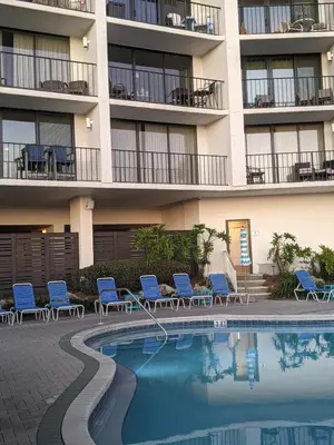 a hotel with a swimming pool in front of a building at Your Paradise Awaits! in Panama City Beach