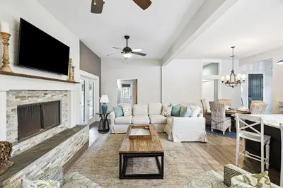 a living room with a couch and a fireplace at Downward Dog by 30A Escapes in Seacrest
