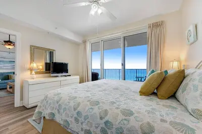a bedroom with a bed with a view of the ocean at Ocean Reef Starfish in Panama City Beach