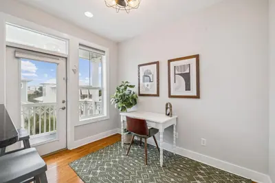 a home office with a desk and a window at Tram-on-Time Main House by 30A Escapes in Rosemary Beach