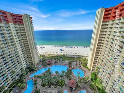 a view of the beach from the balcony of a resort at Blue Skies at Shores in Panama City Beach