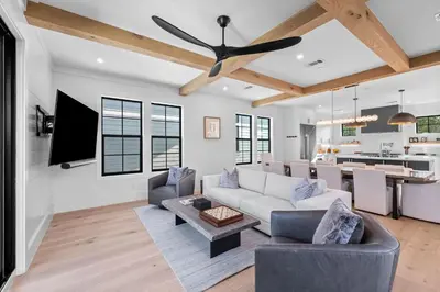 a living room with a couch and a ceiling fan at Endless Views 30A in Santa Rosa Beach