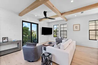 a living room with a white couch and a ceiling fan at Endless Views 30A in Santa Rosa Beach