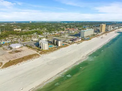 an aerial view of a beach with buildings and the ocean at Beach Front Ocean View Condo - Top of the Gulf 105 in Panama City Beach