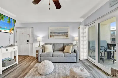 a living room with a couch and a table at Largo Dream at Largo Mar in Panama City Beach