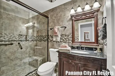 a bathroom with a toilet and a shower and a sink at Largo Dream at Largo Mar in Panama City Beach