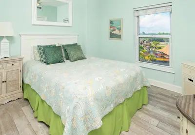 a bedroom with a bed and a window at Sugar Sand at Ocean Reef in Panama City Beach