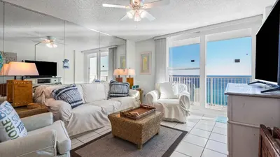 a living room with a couch and chairs and a television at BeachCrest 1202 in Santa Rosa Beach