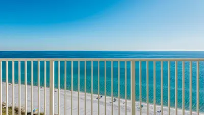 a view of the beach and the ocean from a balcony at BeachCrest 1202 in Santa Rosa Beach