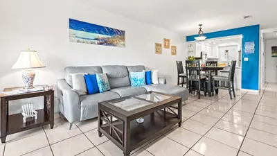 a living room with a couch and a table at Portside Resort V4 in Panama City Beach
