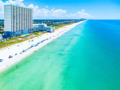 an aerial view of a beach and the ocean at The Sandy Pearl at Ocean Reef in Panama City Beach