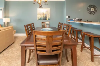 a dining room with a table and chairs at Blue Horizon at Ocean Reef in Panama City Beach