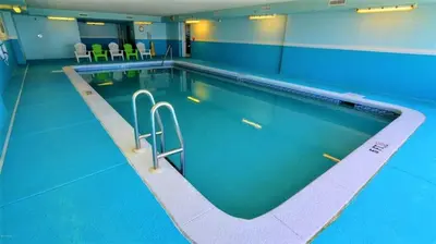 a large swimming pool in a building at Blue Horizon at Ocean Reef in Panama City Beach