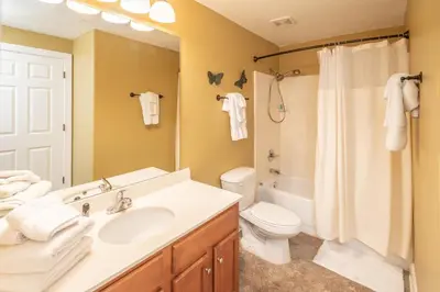 a bathroom with a sink and a toilet and a shower at Forever Fun at Ocean Reef in Panama City Beach