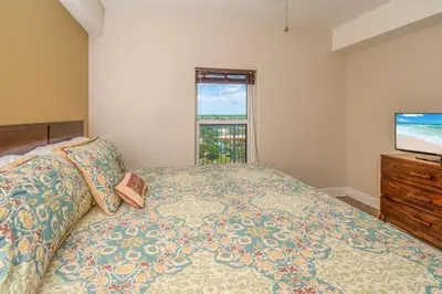 a bedroom with a bed and a flat screen tv at Forever Fun at Ocean Reef in Panama City Beach