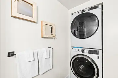 a laundry room with a washer and dryer at Pelicans Point South at Shores in Panama City Beach
