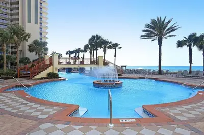 a large pool with a fountain in a resort at Pelicans Point South at Shores in Panama City Beach