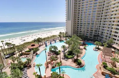 an aerial view of a resort with a pool and the beach at Pelicans Point South at Shores in Panama City Beach