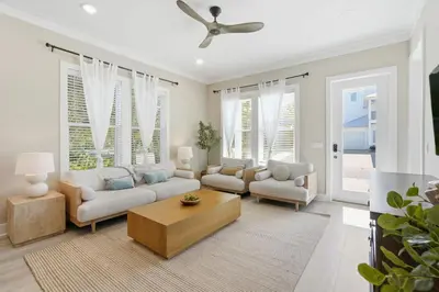 a living room with a couch and a table at Family Coastal Escape in Inlet Beach