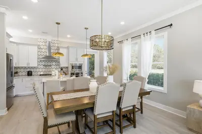 a kitchen and dining room with a table and chairs at Family Coastal Escape in Inlet Beach