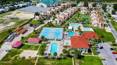 an aerial view of a resort with a swimming pool at The Shell House in Panama City Beach