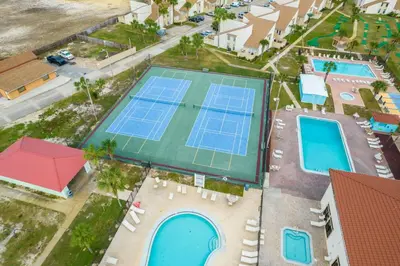 an overhead view of a tennis court with two tennis courts at The Shell House in Panama City Beach