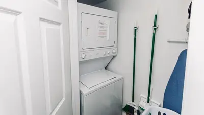 a kitchen with a refrigerator and a washer and dryer at Cheap Getaway, Ocean View, PCB in Panama City Beach
