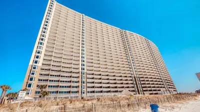 a large building sitting on top of a beach at Cheap Getaway, Ocean View, PCB in Panama City Beach